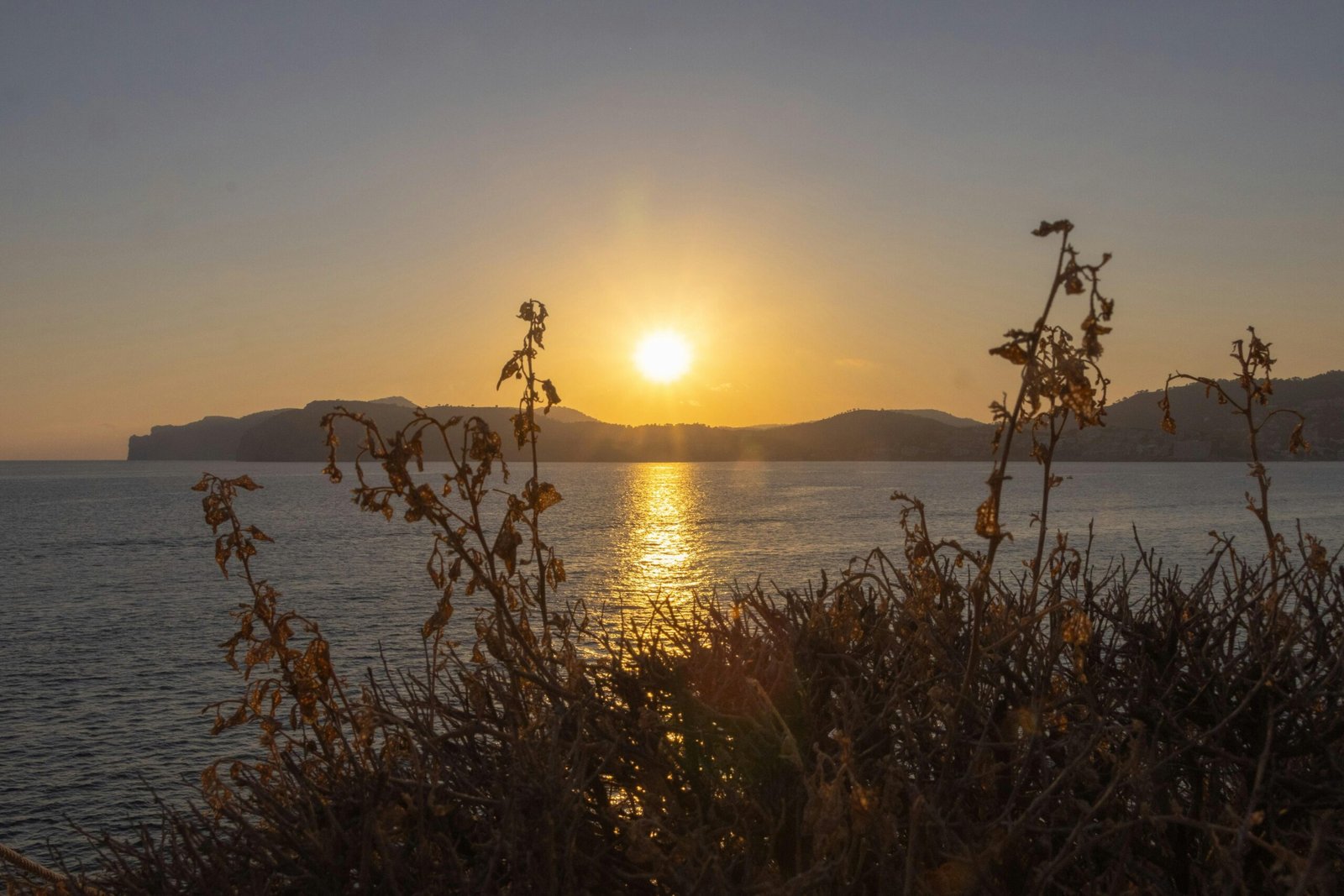 Sonnenuntergang über Wasser auf Mallorca bei Kenny Van Roosbroek